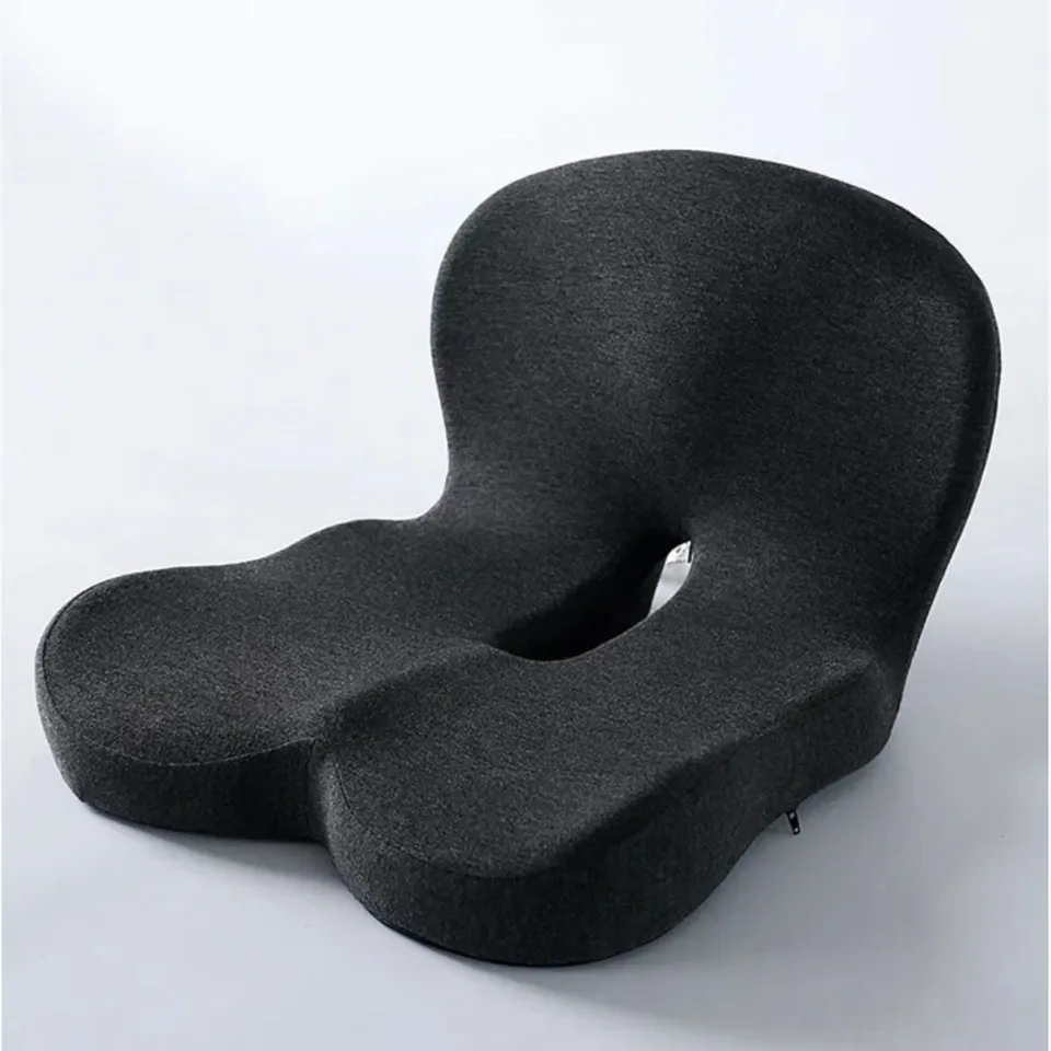 Black L-shaped memory foam seat cushion with a raised back support and a tailbone cut-out